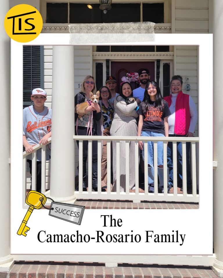 A photo of a group of people standing at the top of some stairs in front of a house