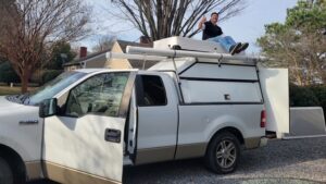 Maintenance manager Will Steele sitting on a truck