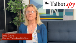Julie Lowe, TIS Executive Director, sitting on a couch