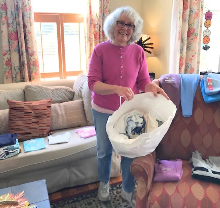 Photo of Sandra Hack standing in the Easton's Promise living room
