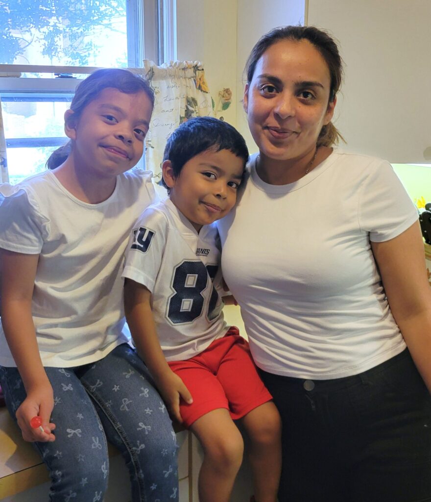 Dulce and her two children in the kitchen at Easton's Promise