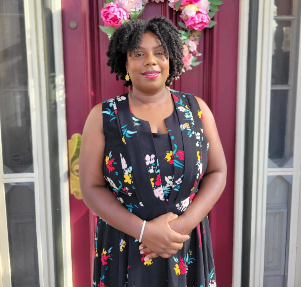 Sade in front of the door to Easton's Promise.