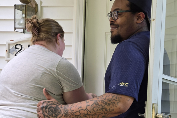 Couple opening the door to their apartment