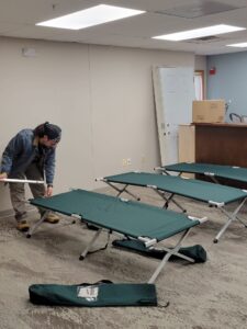 Shai putting cots together