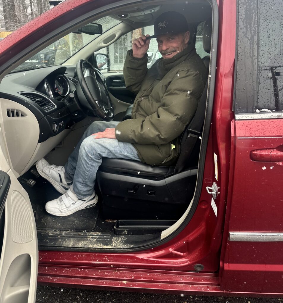 Howard in his new car